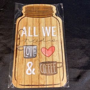 Wooden mason jar shaped sign; all we need is love & coffeeIncludes twine string.